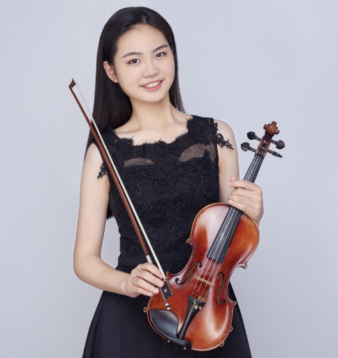 Senior Iris Shi posing with her violin Photo courtesy of Iris Shi | Used with Permission